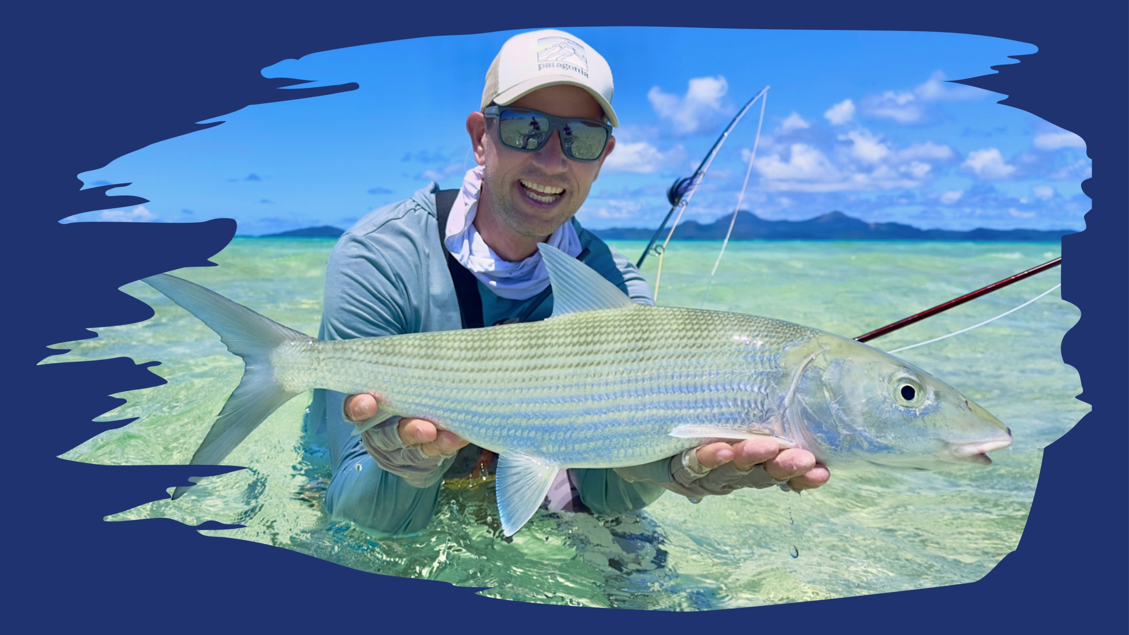 Bonefishing French Polynesia — angler holding a beautiful bonefish on the crystal-clear flats of the South Pacific